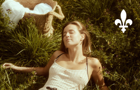 Woman lying in the grass in a camisole