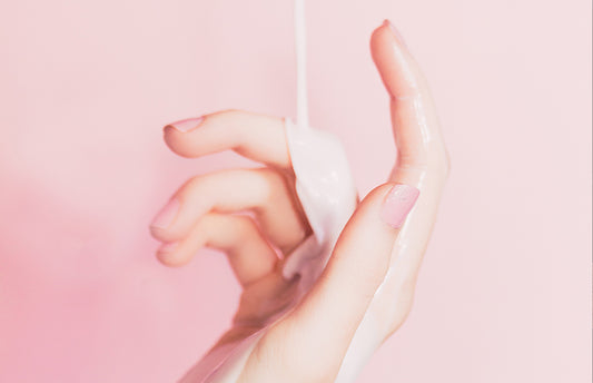 Picture of a hand with cream dripping on it via Unsplash