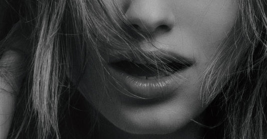 Picture black and white of woman lips close up via Unsplash